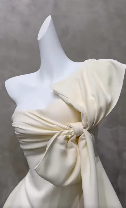 Side view of the asymmetrical neck A-line short dress.