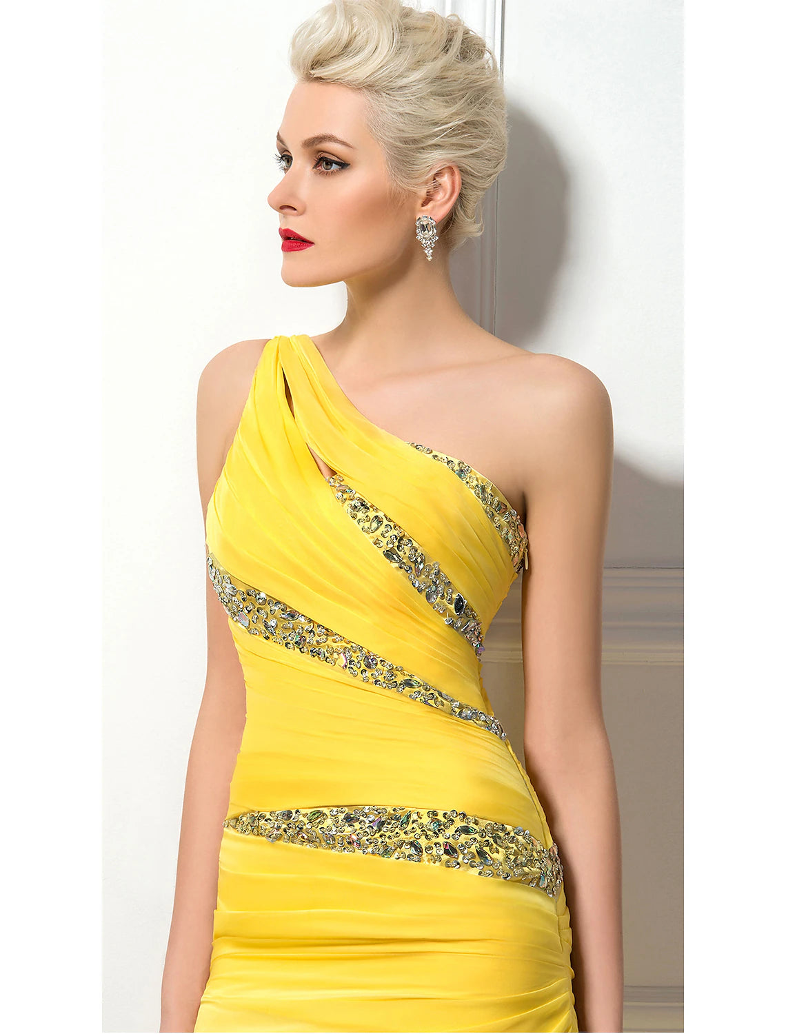 Close-up of the ruched bodice and sequin embellishments on the chiffon evening dress.