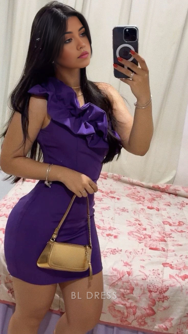 Woman wearing a long purple one-shoulder sheath dress, suitable for formal events.