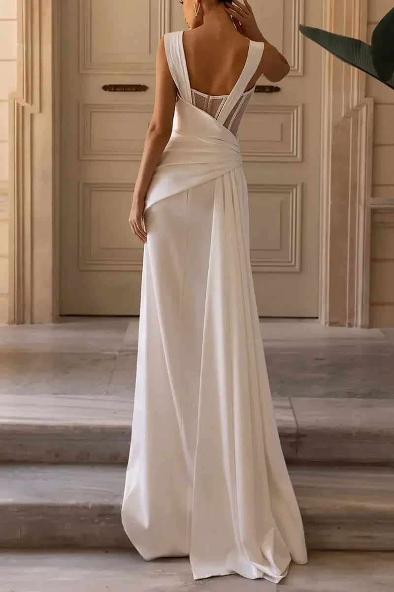 Ankle-length bridal gown, sleeveless design.