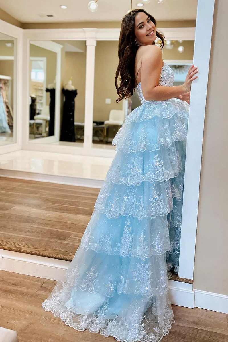 Side view of light blue strapless sequin tulle A-line prom dress.