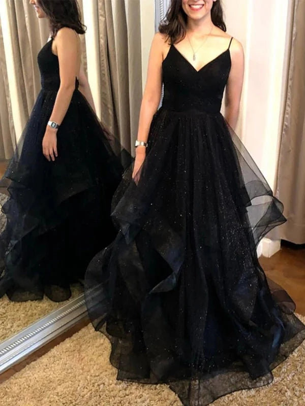 Woman wearing a shimmering A-line V-neck backless sequin long prom dress.