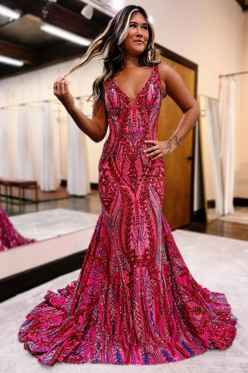 Woman wearing a shimmering V-neck mermaid sequin long prom dress.