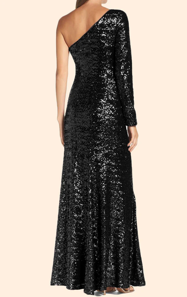Elegant woman posing in a dazzling one-shoulder, long-sleeve sequin prom gown.