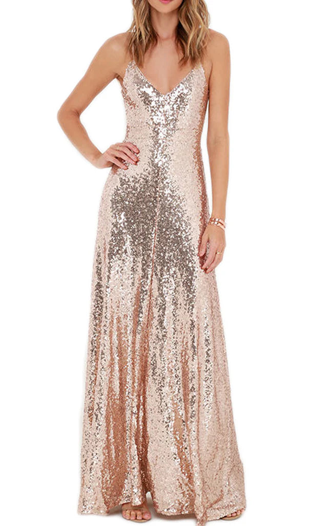 Woman wearing a shimmering sequin V-neck formal dress with spaghetti straps.