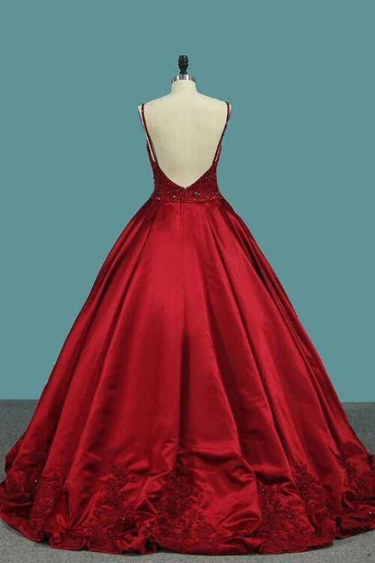 Back view of the formal satin gown with delicate crystal details.