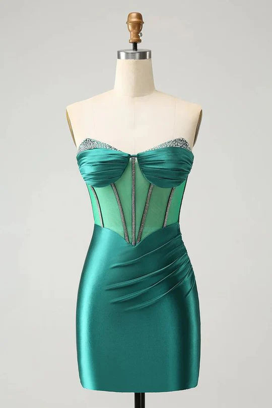 Woman wearing a shimmering strapless beaded mini homecoming dress.