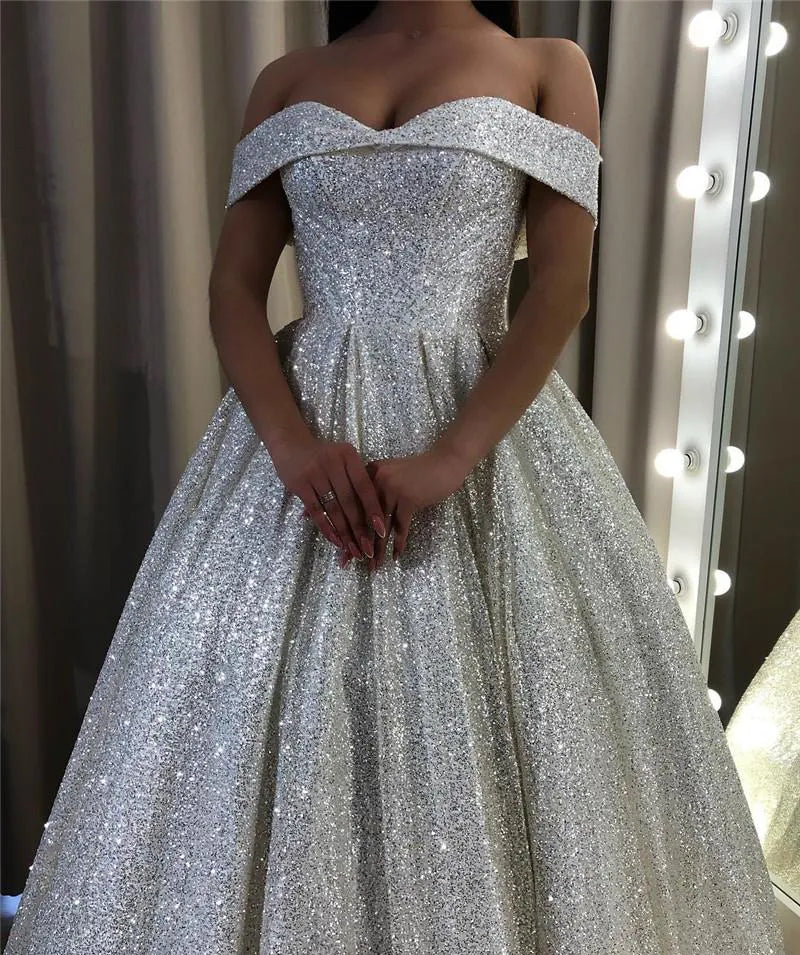 Close-up of shimmering sequin detail on a bridal gown.