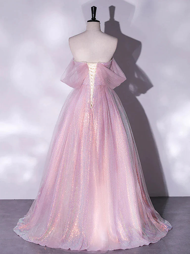 Back view of a long periwinkle blue tulle prom dress with a flowing skirt.