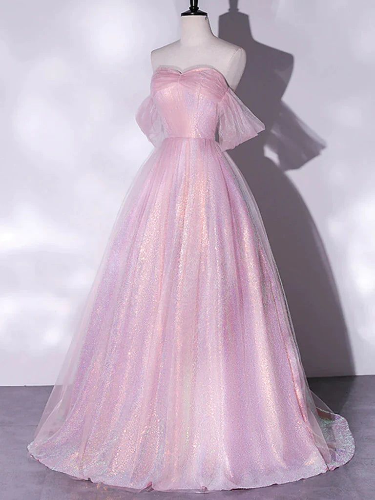 Close-up of the shiny tulle fabric and off-shoulder detail on a blue prom dress.