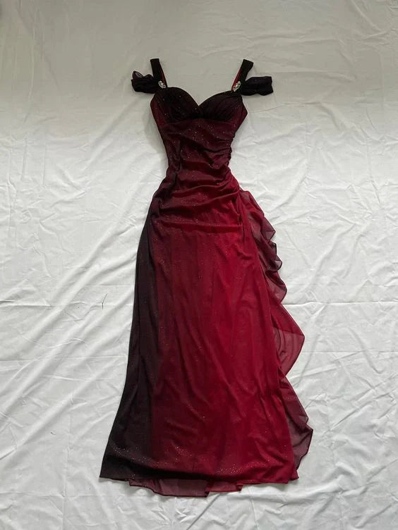 Woman wearing a shiny ruffled A-line V-neck burgundy long formal dress.