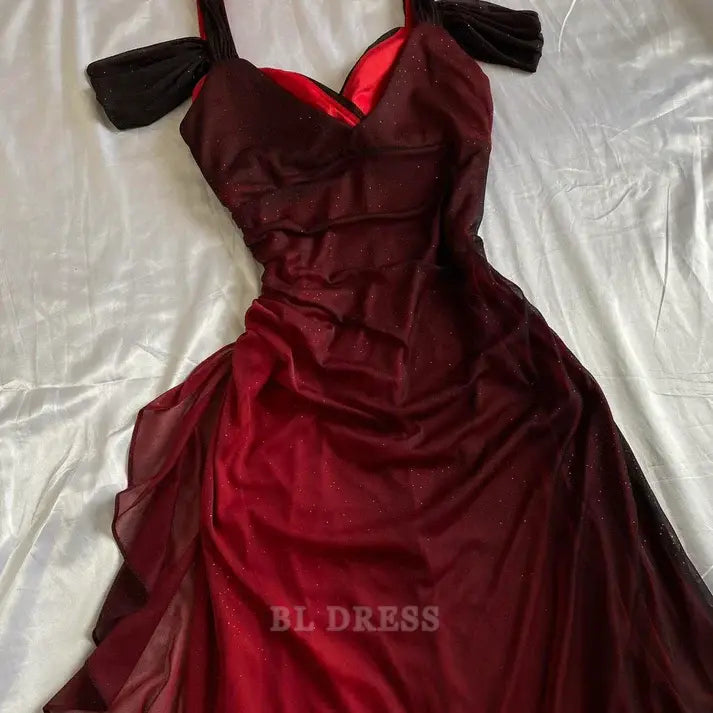 Close-up of the shimmering fabric and ruffled details on a burgundy A-line dress.