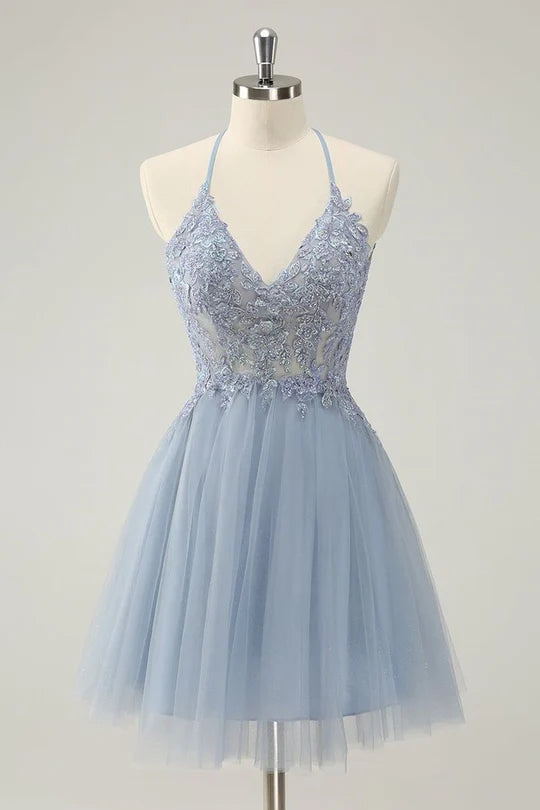 Sparkly A-line halter homecoming dress with elegant floral appliques.