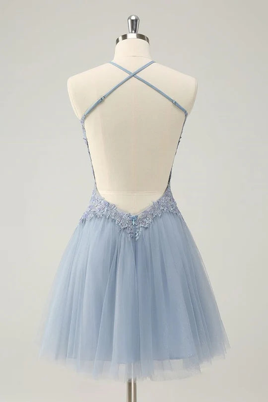 Back view of sparkly A-line halter dress with elegant appliques.