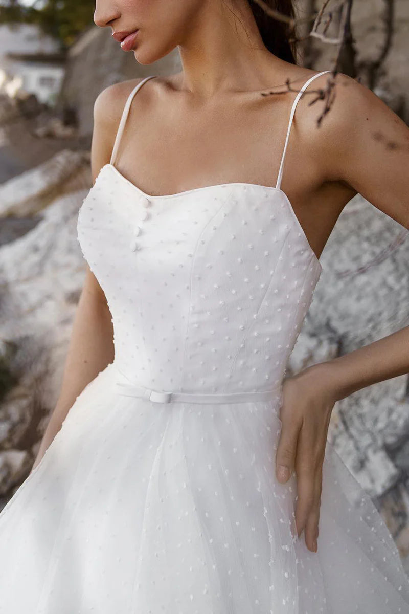 Side profile of a model in the elegant A-line wedding dress.
