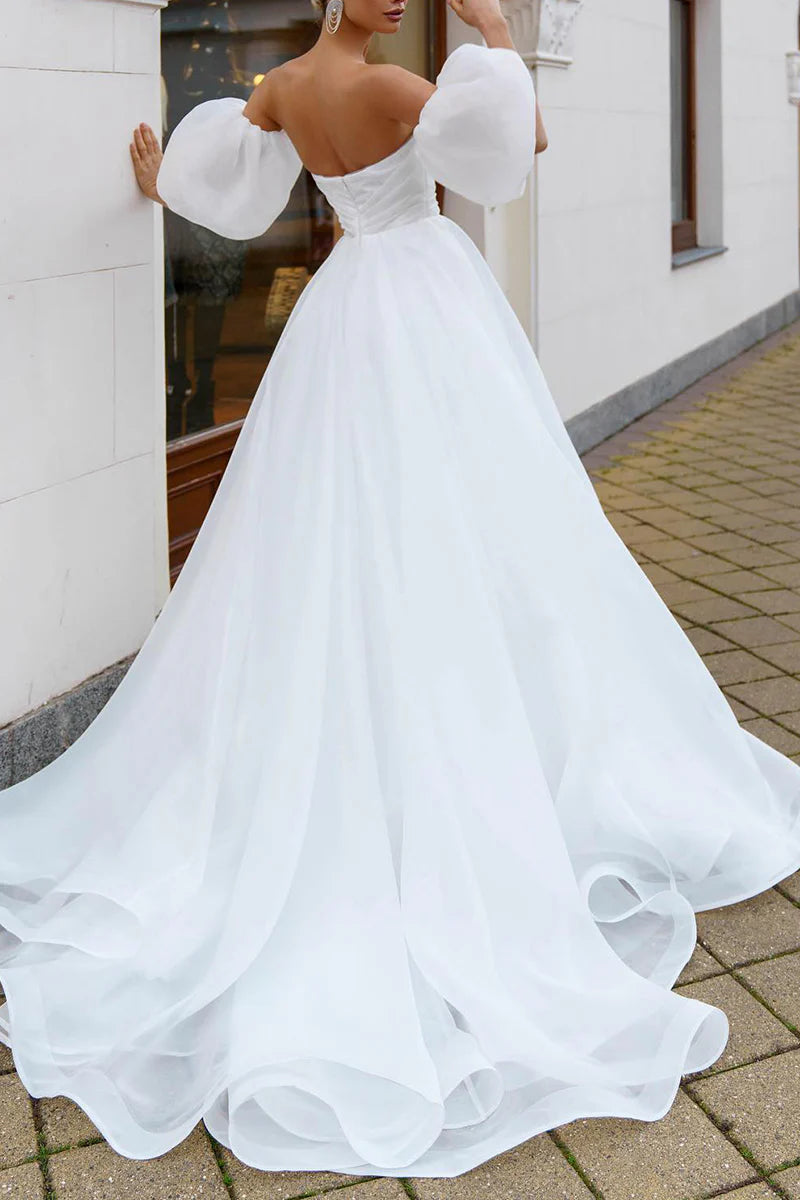 Back view of simple A-line wedding dress.
