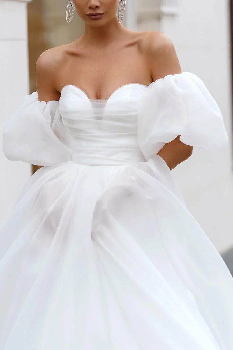 Front view of simple sweetheart wedding dress.