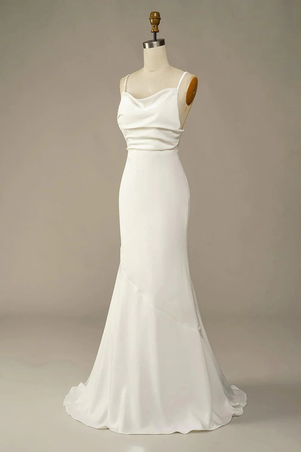 Simple long soft satin beach wedding gown with V-neckline.