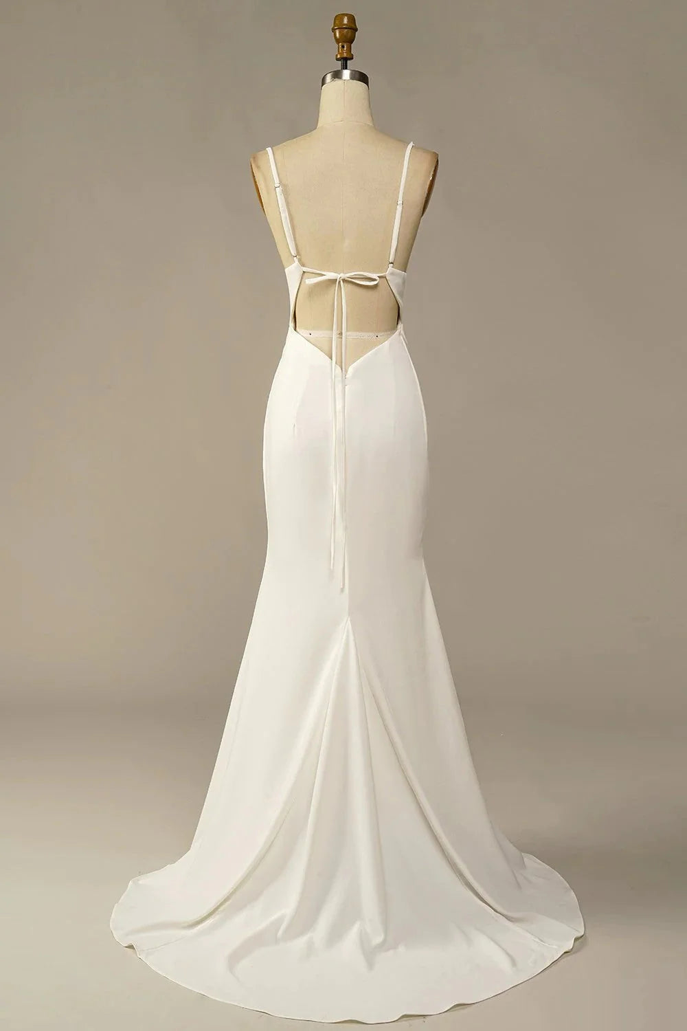 Back view of a flowing soft satin wedding dress.