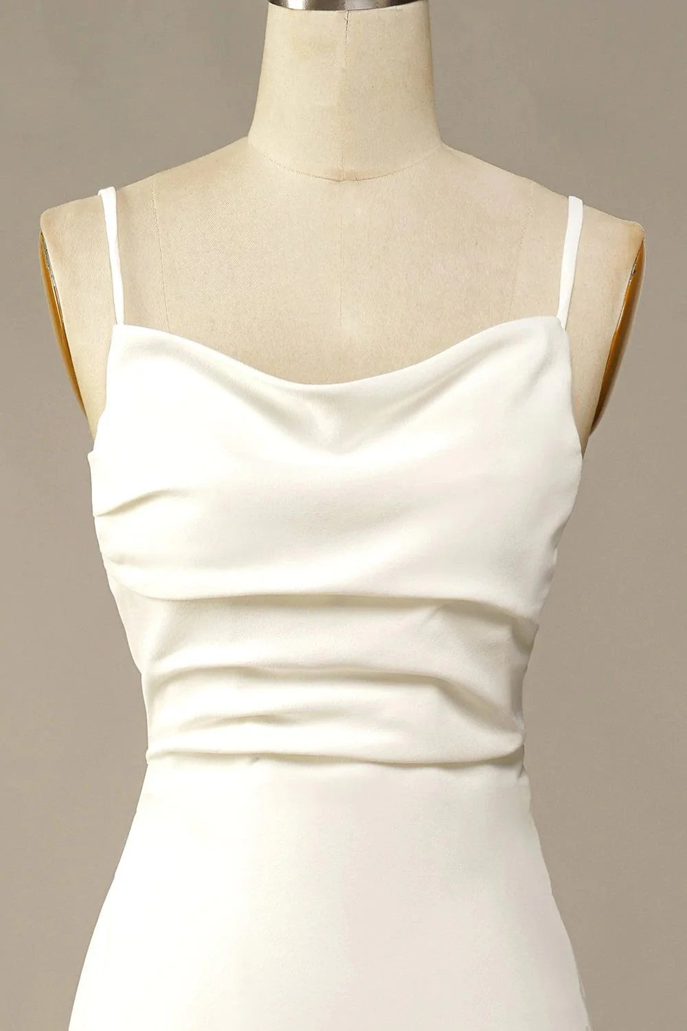 Side view of an elegant sleeveless satin bridal gown.