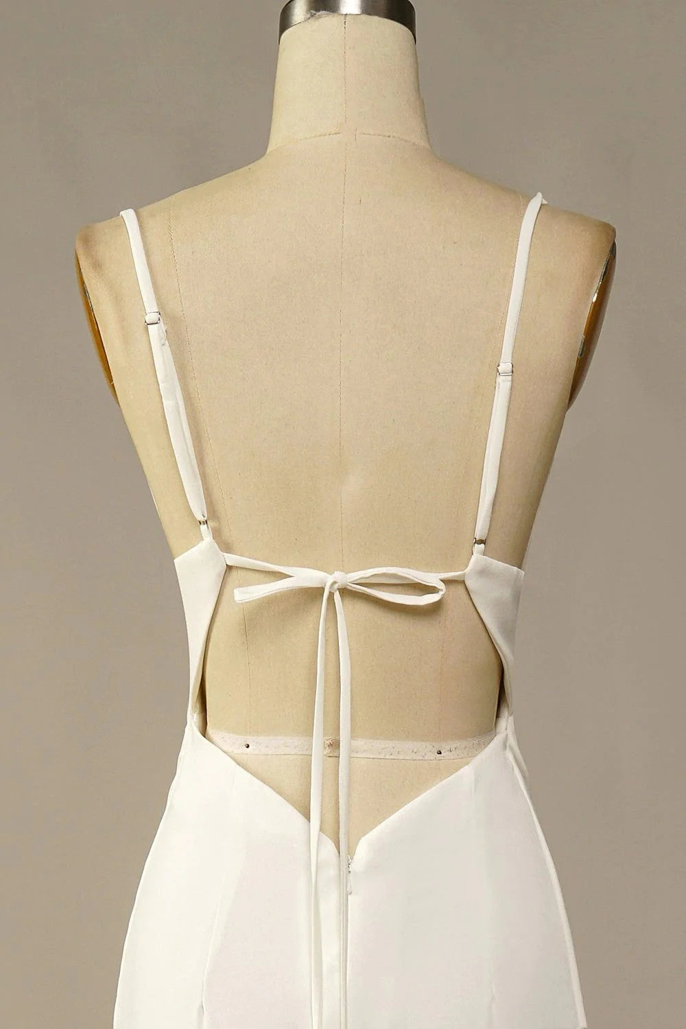 Close-up of the soft satin fabric on a wedding dress.