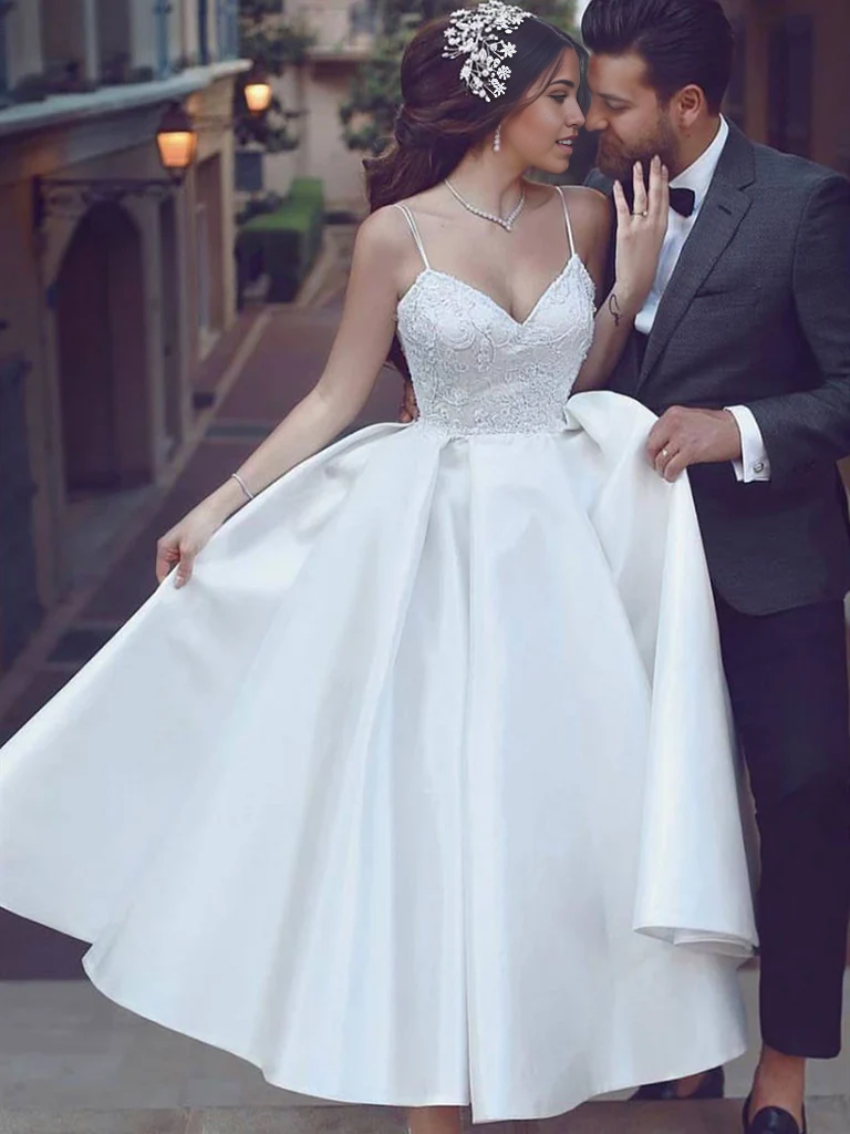 White A-line tea length dress with sweetheart neckline.