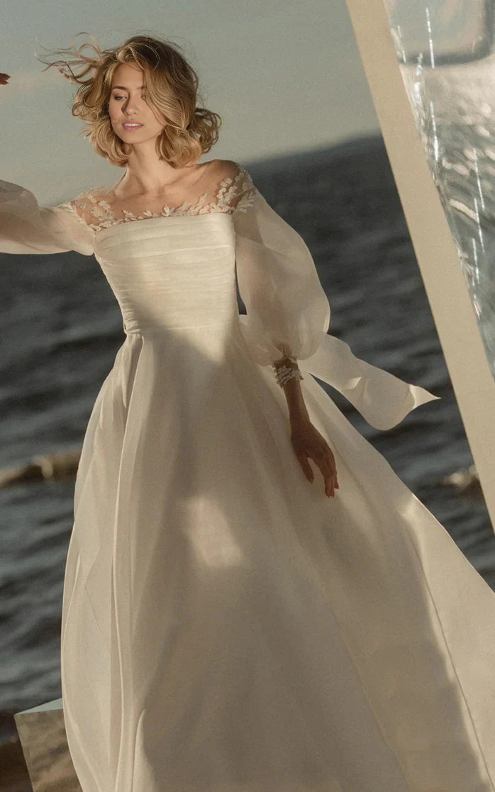 Side view of a bride wearing the flowing A-line wedding dress.
