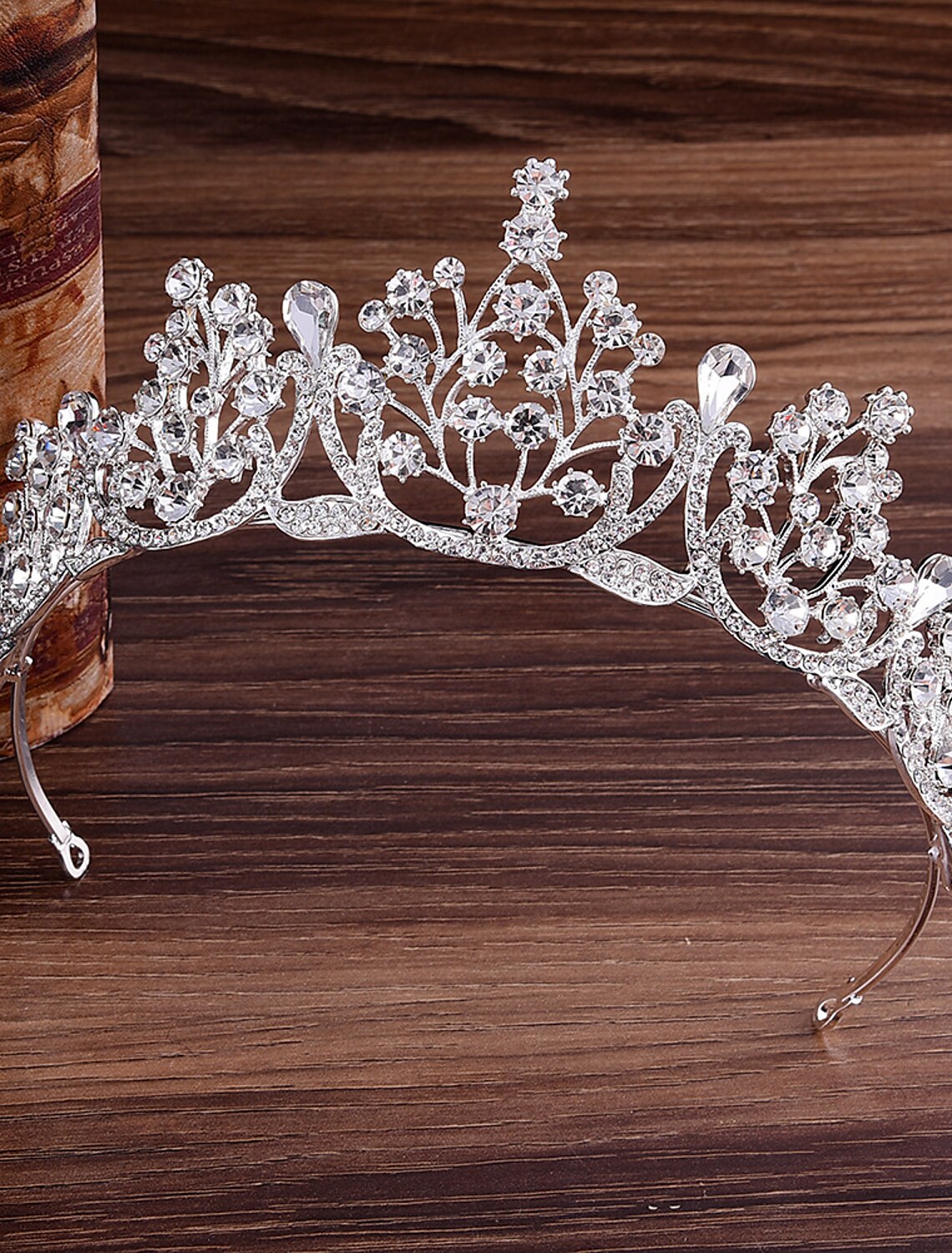 Bridal model wearing a simple metal crown tiara.