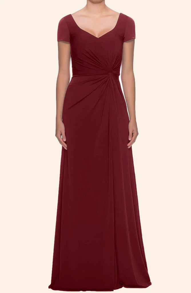 Elegant sleeveless V-neck formal dress in a rich color, modeled by a woman.