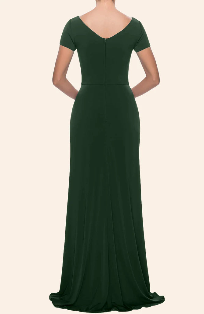 Woman modeling a sleeveless V-neck ankle-length formal gown, showing back detail.