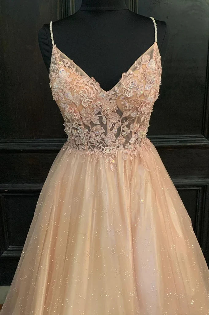 Woman in A-line V-neck lace long prom dress.