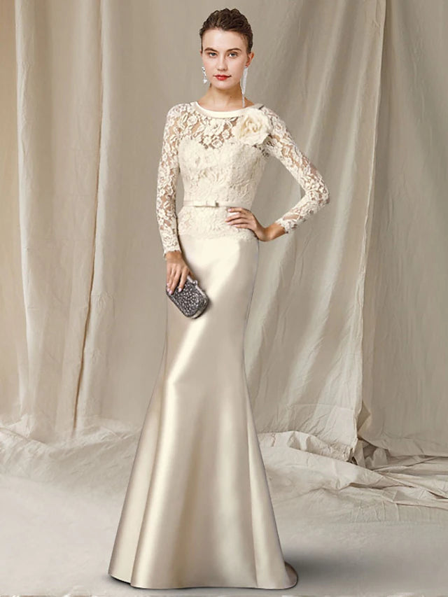 Elegant A-Line Mother of the Bride gown with V-neck, long sleeves, satin and lace details.