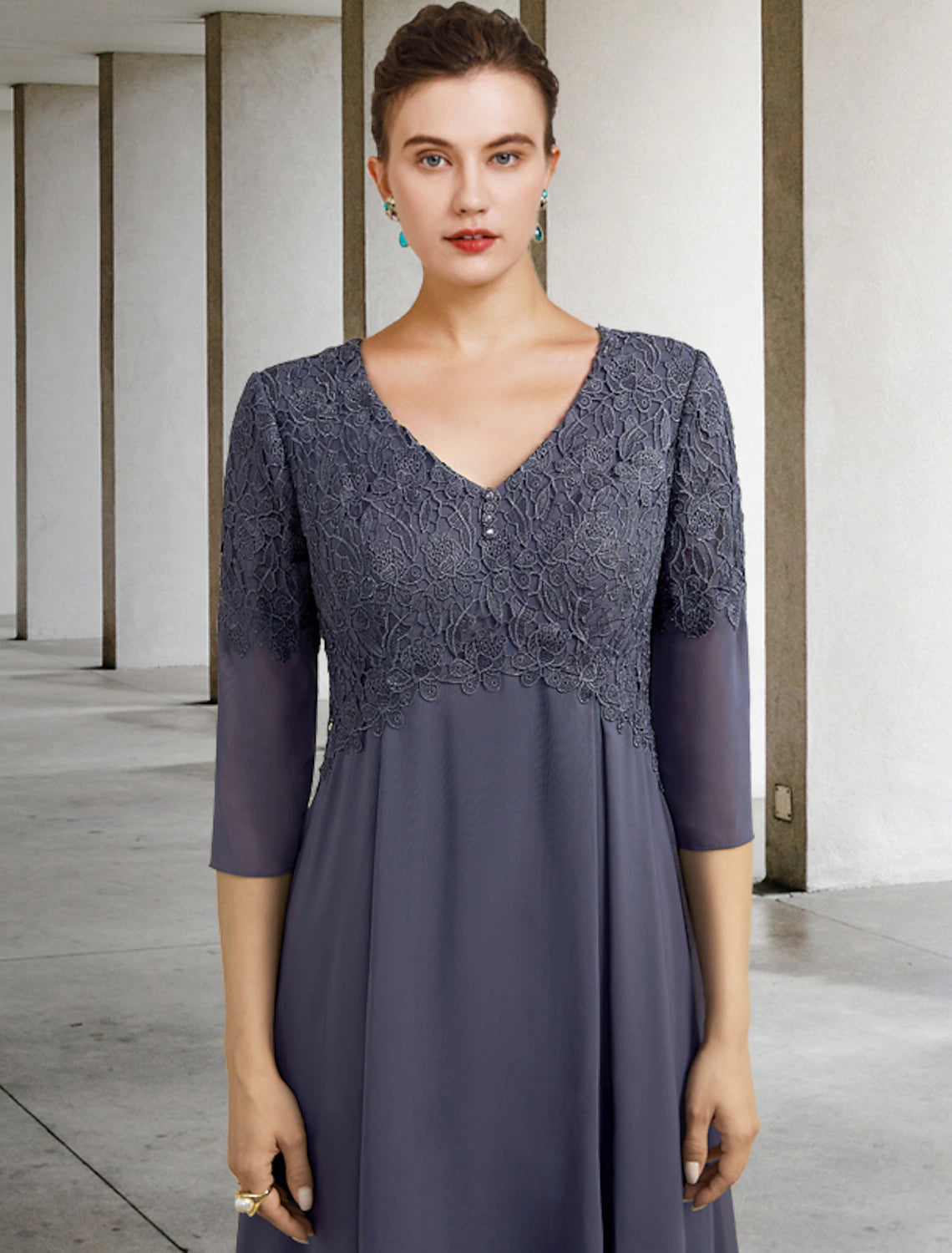 Full view of the plus size A-line tea length mother of the bride dress.