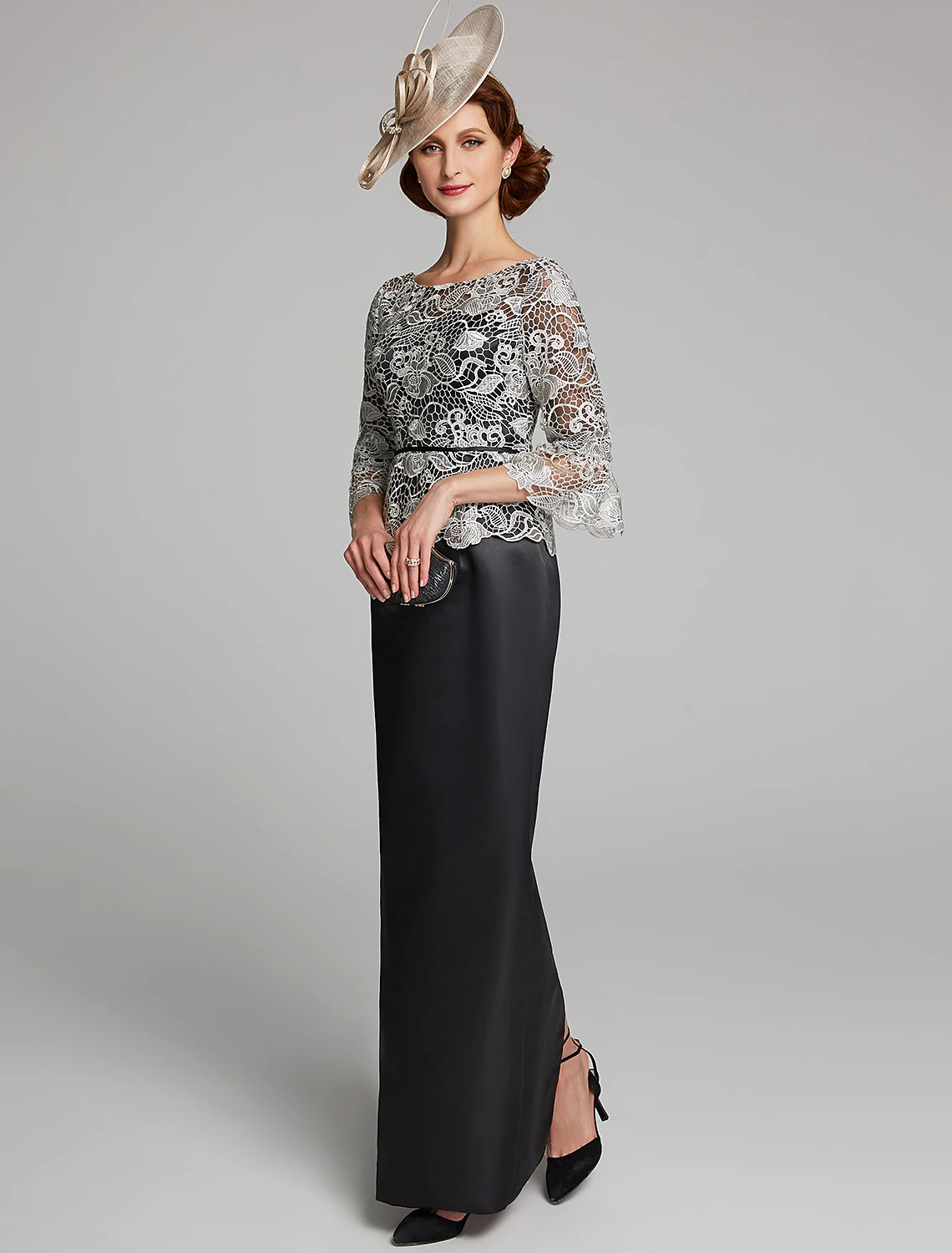 Side profile of the dark blue floor-length mother of the bride dress.