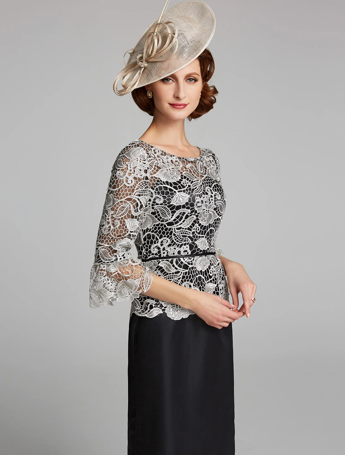 Detail of the 3/4 length lace sleeve on the dark blue satin gown.