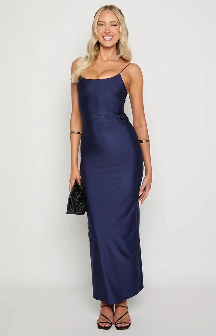 Back view of navy blue prom dress showing open back design.