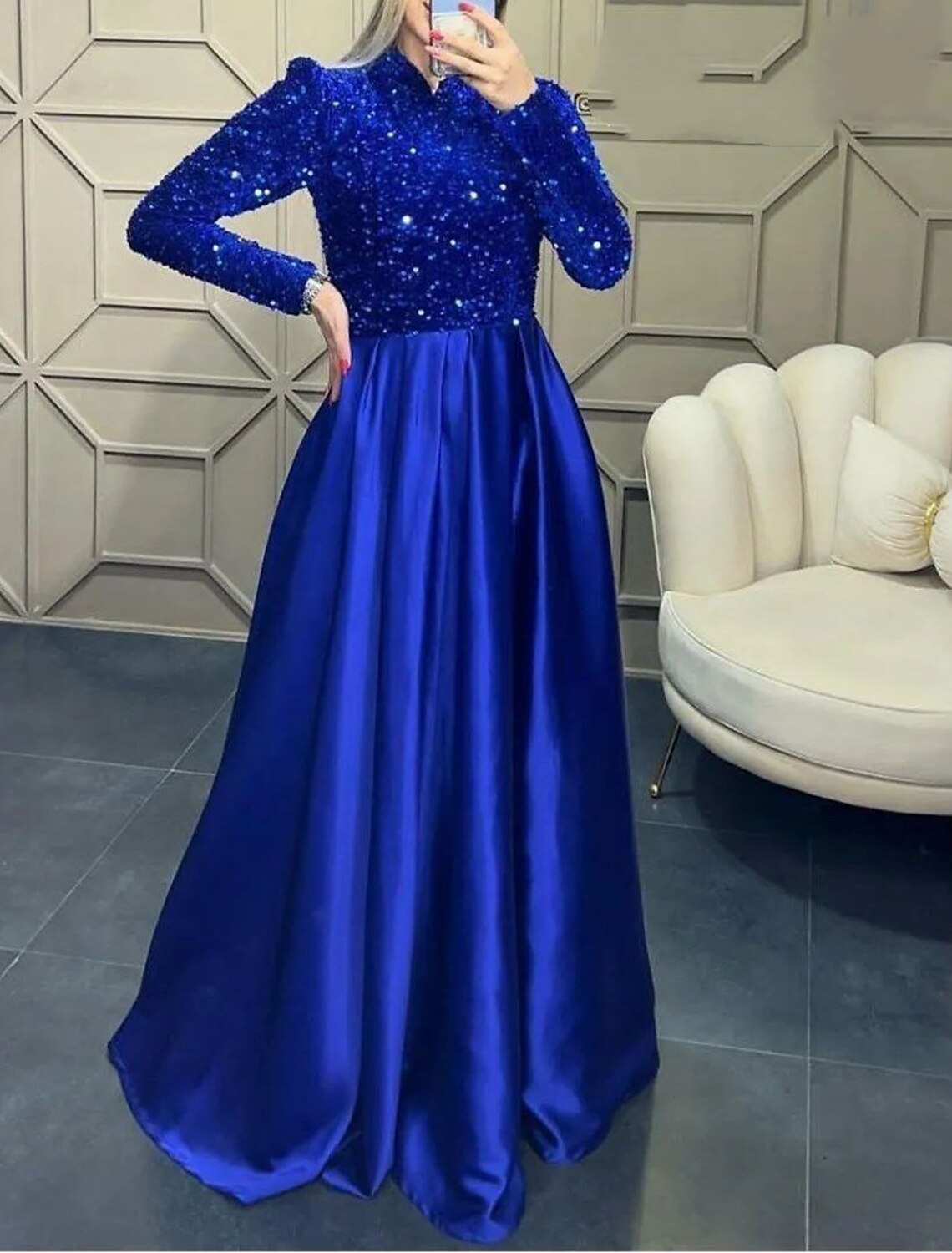Close-up of the sequin and satin fabric on the red evening gown.