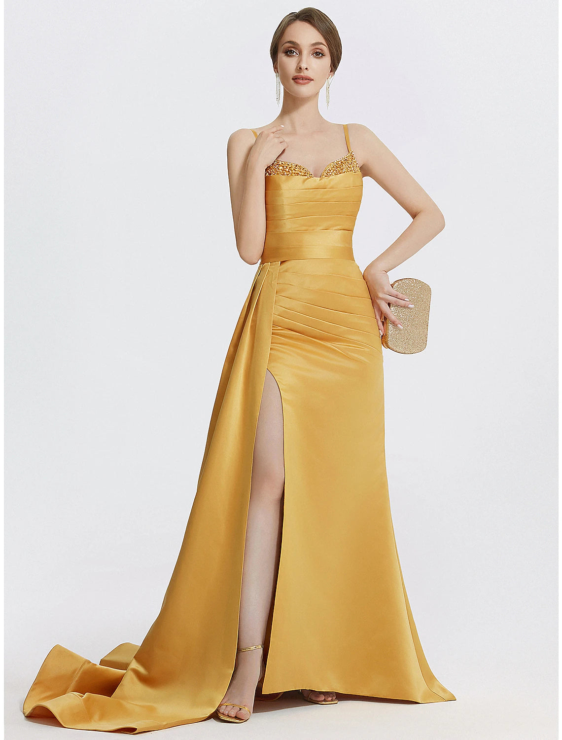 Full view of a sparkling A-line satin evening gown with spaghetti straps.