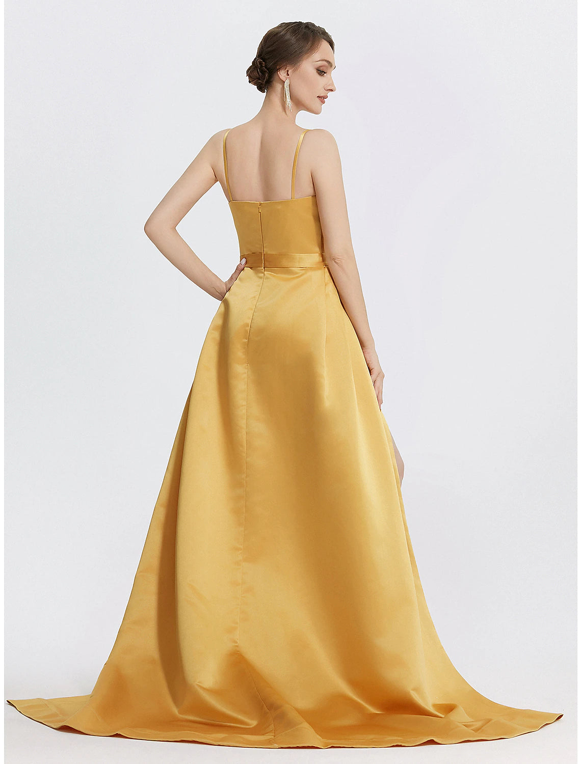 Close-up of the ruched bodice and delicate spaghetti straps on the gown.