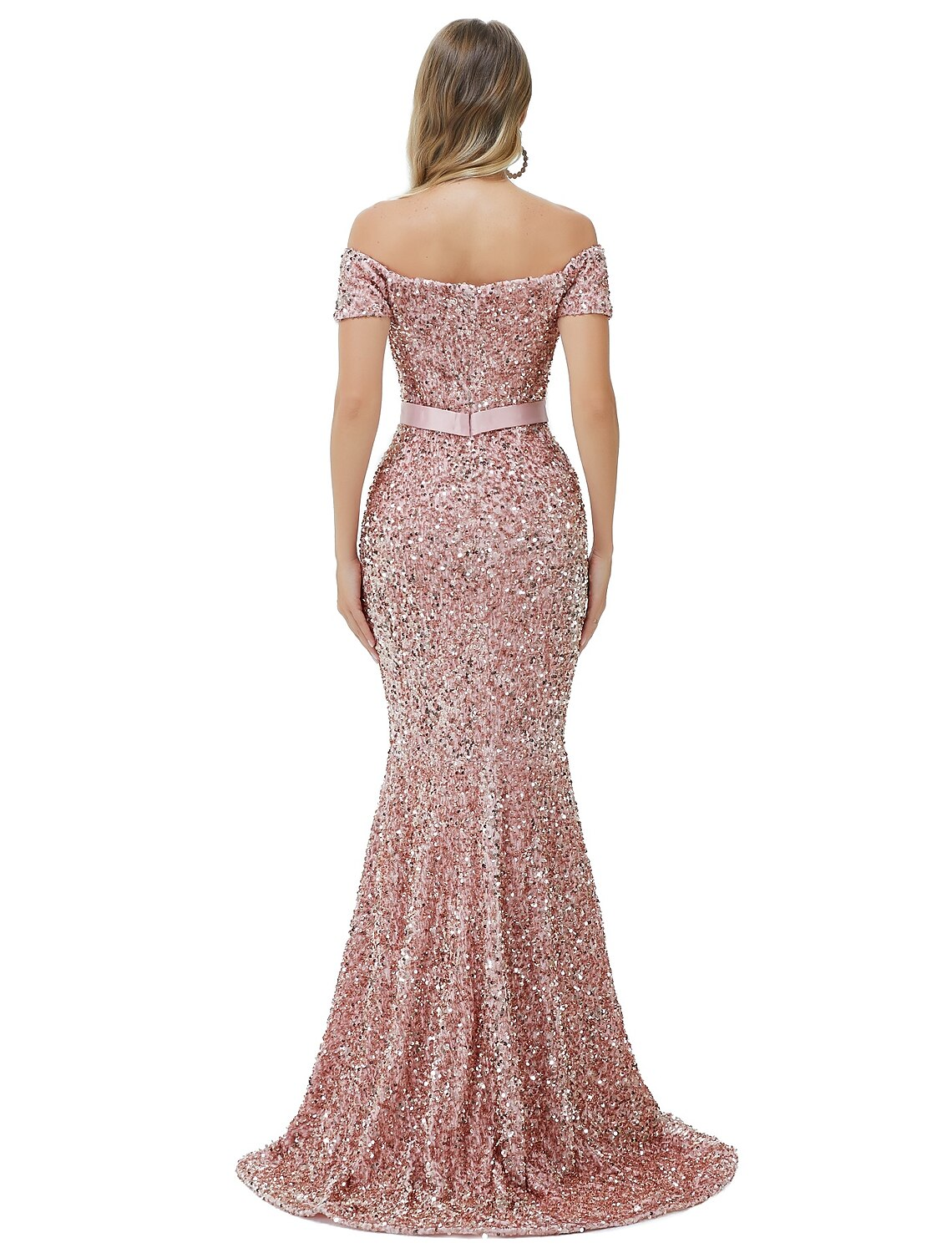 Back view of a woman in a sequined mermaid dress with a cowl back.