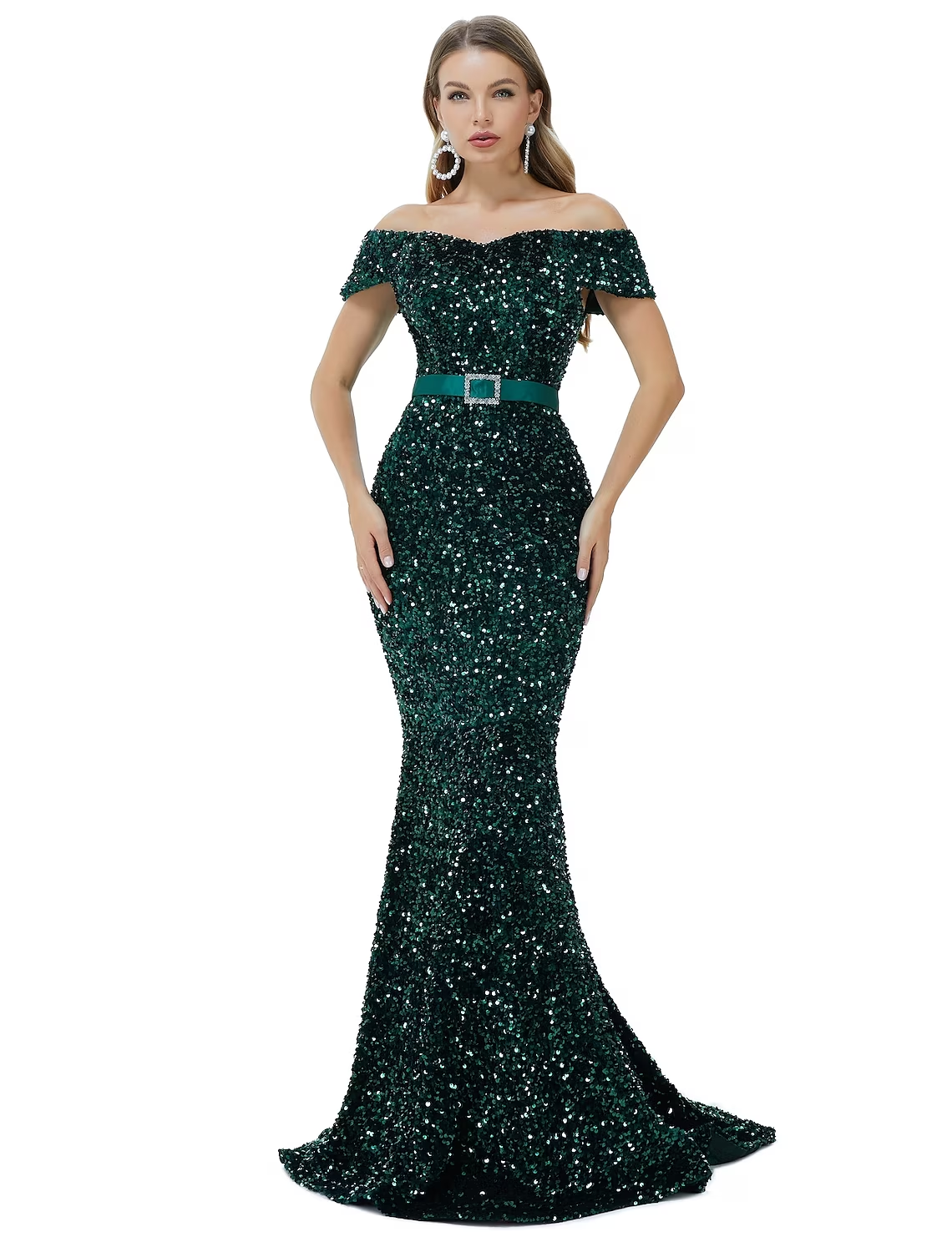 Side profile of a woman in an elegant off-shoulder sequin gown.