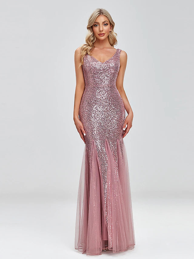 Woman wearing a sparkling V-neck mermaid trumpet evening gown.