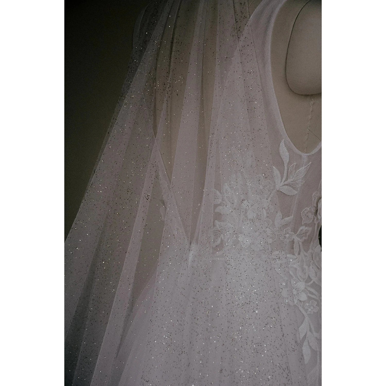 Close-up of the sequin detailing on a wedding veil.