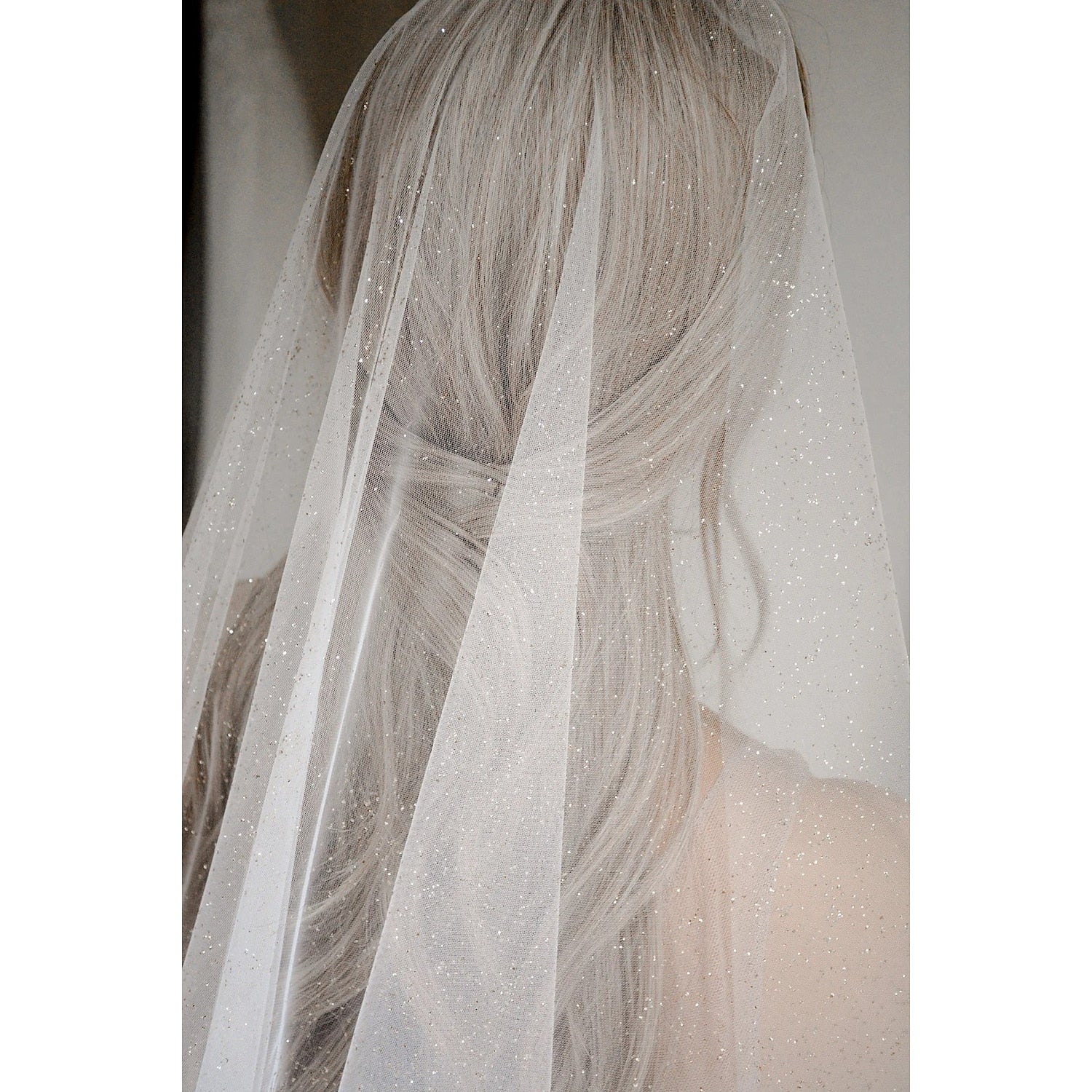 Detailed view of the sequin pattern on a bridal veil.