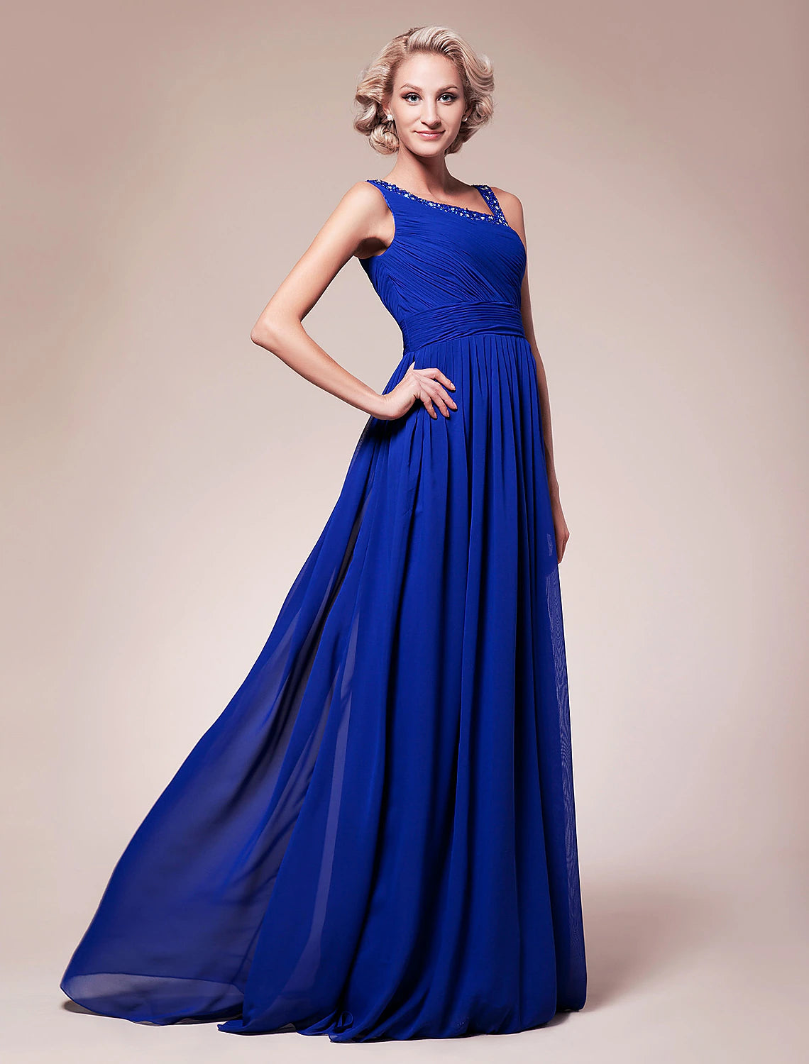 Close-up of sparkling straps and intricate beading on the A-line dress bodice.