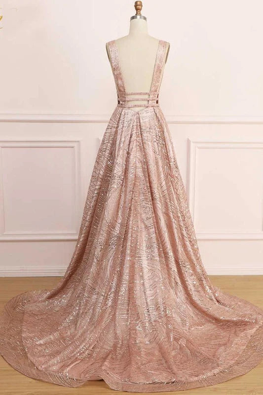 Woman in a sequin glitter A-line prom dress, side profile view.