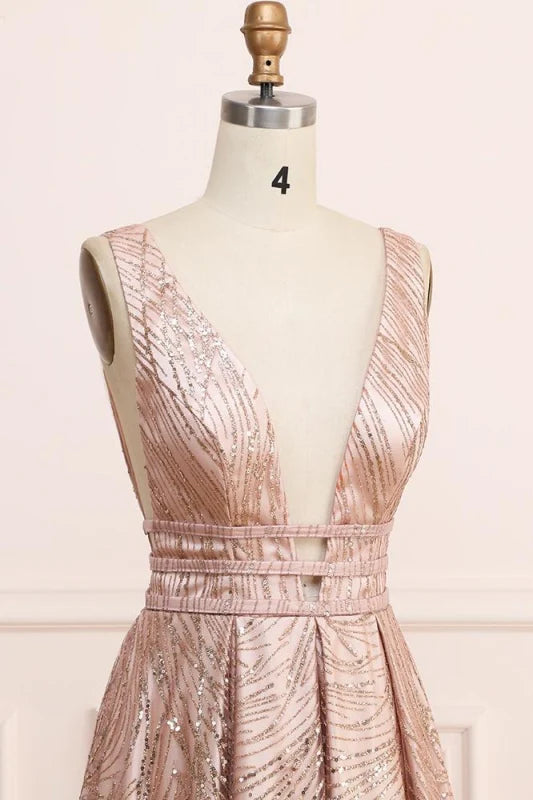 Woman posing elegantly in an ankle-length A-line sequin glitter formal gown.