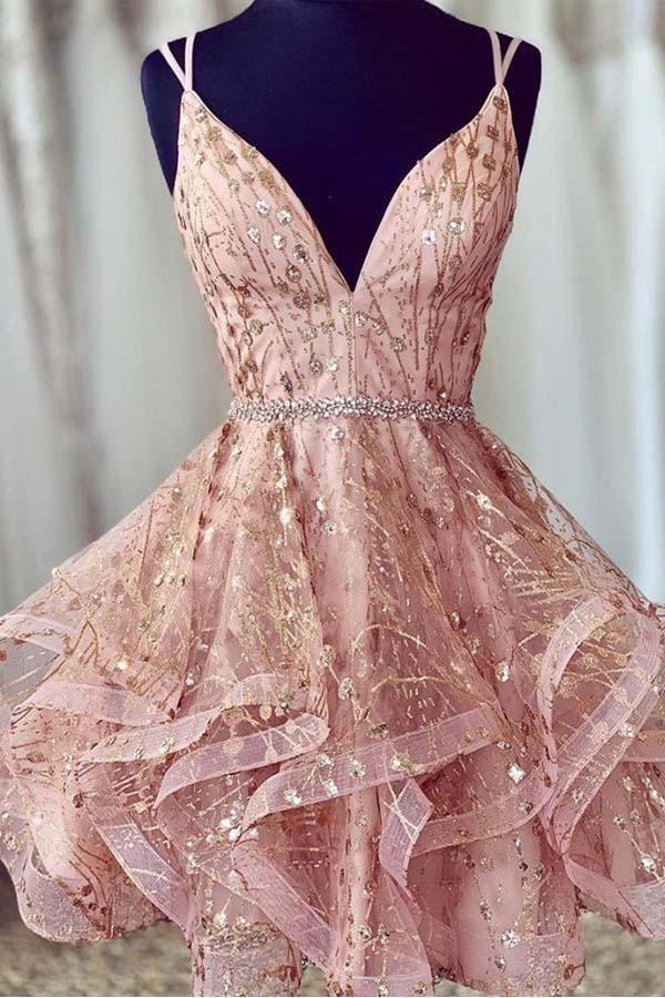 Model wearing a sparkling pink sequined deep V-neck A-line short homecoming dress.