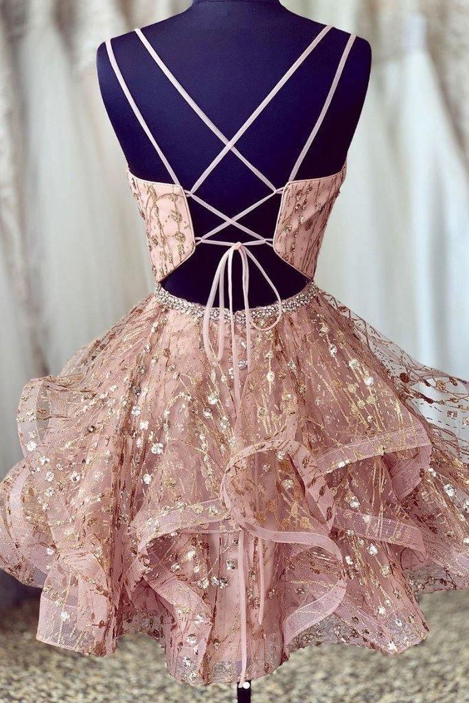 Close-up of the pink sequined deep V-neck short homecoming dress with A-line skirt.