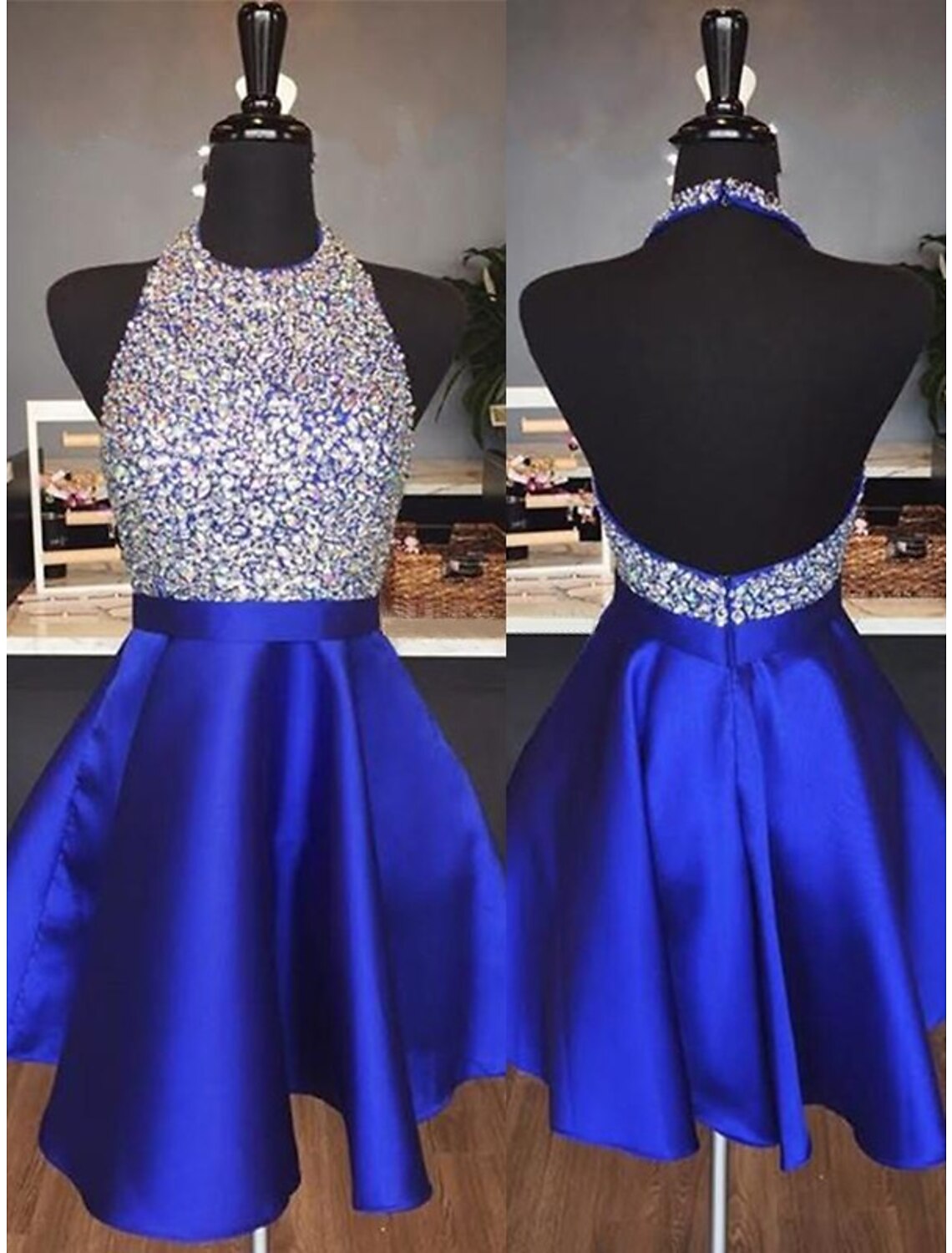 Model wearing a sparkling A-line halter backless mini homecoming dress with sequins and pleats.